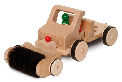 Straatveegborstel geplaatst voor de speelgoed vrachtwagen.