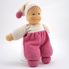 La bambolina in spugna bianca e rosa di 26 cm sta in piedi.