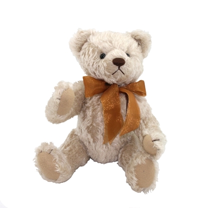 Witte teddy beer in mohair met een grote bruine strik.