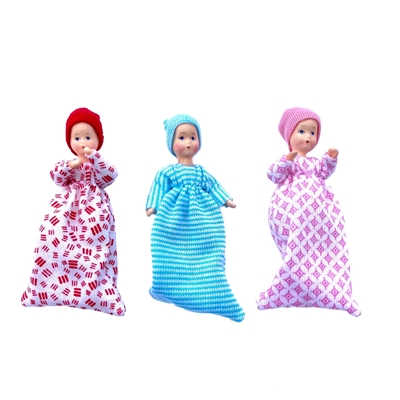 Three flexible Erna Meyer dolls babies, one with red clothes, one with blue clothes, one with pink clothes.