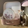 Pink cardboard suitcase with in it an embroidery kit for kids.