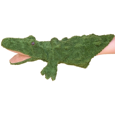Groene krokodil handpop met open bek geschoven over een hand.
